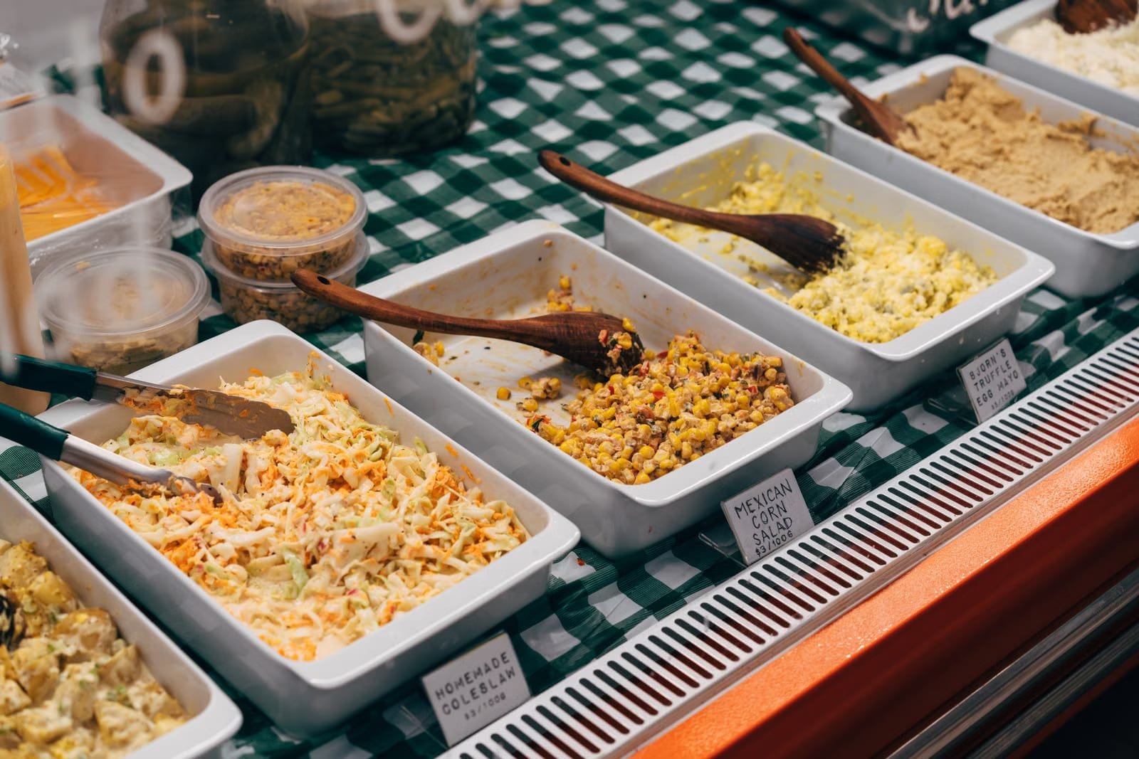 Full barbecue buffet spread with sides laid out for a catered event