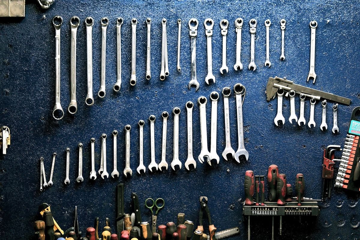 Representative photo of a wall of organized mechanic's wrenches and tools.