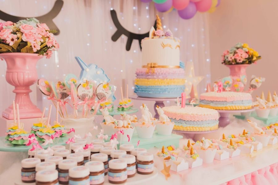 Colorful quinceañera and birthday cake dessert table