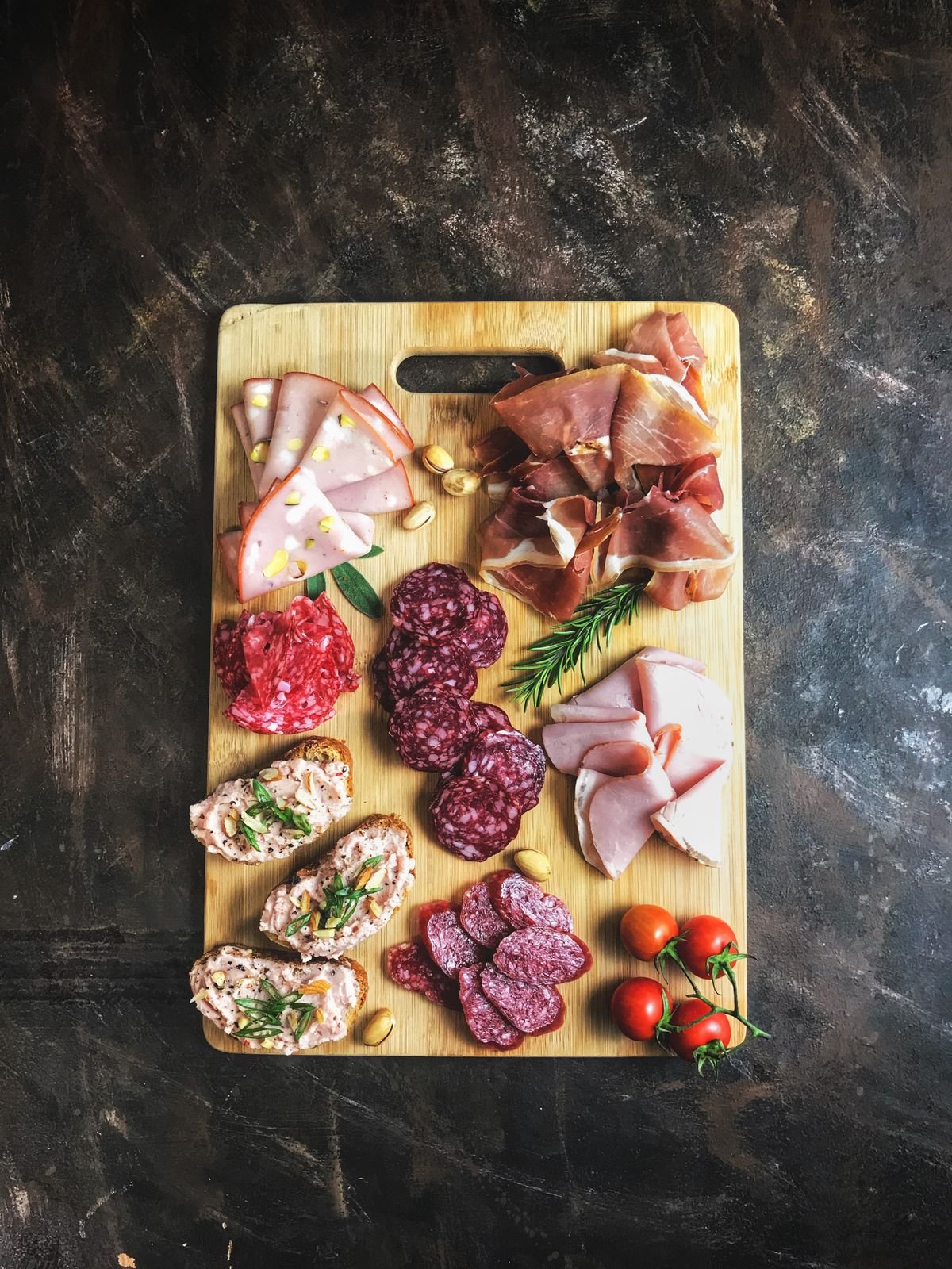 Representative photo: a charcuterie board of sliced salami, chorizo, ham and prosciutto.