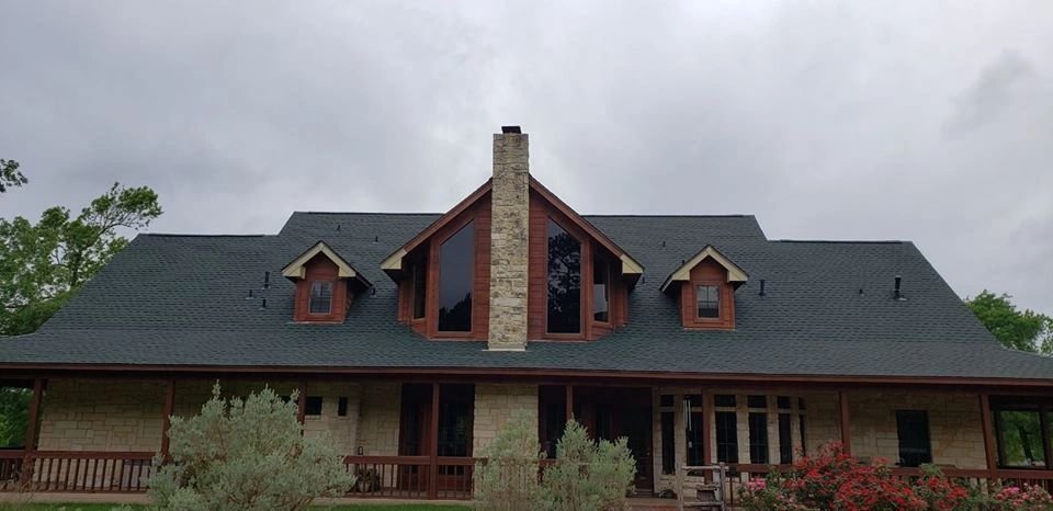 Large remodeled home with a new roofline by Olivo Remodeling