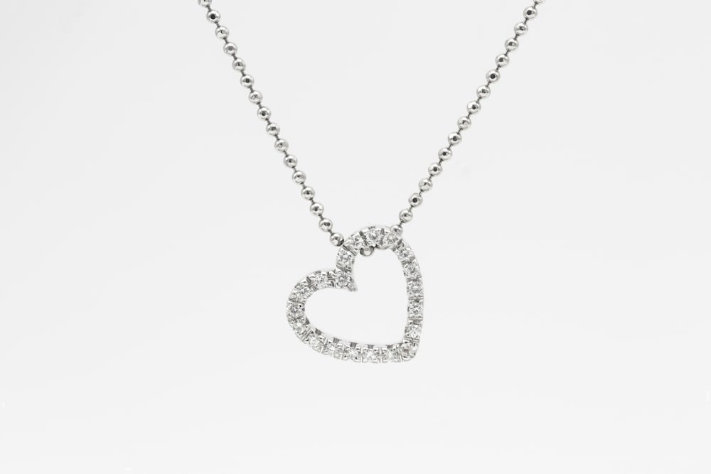 Representative photo of a white-gold diamond heart pendant — client inventory swaps in