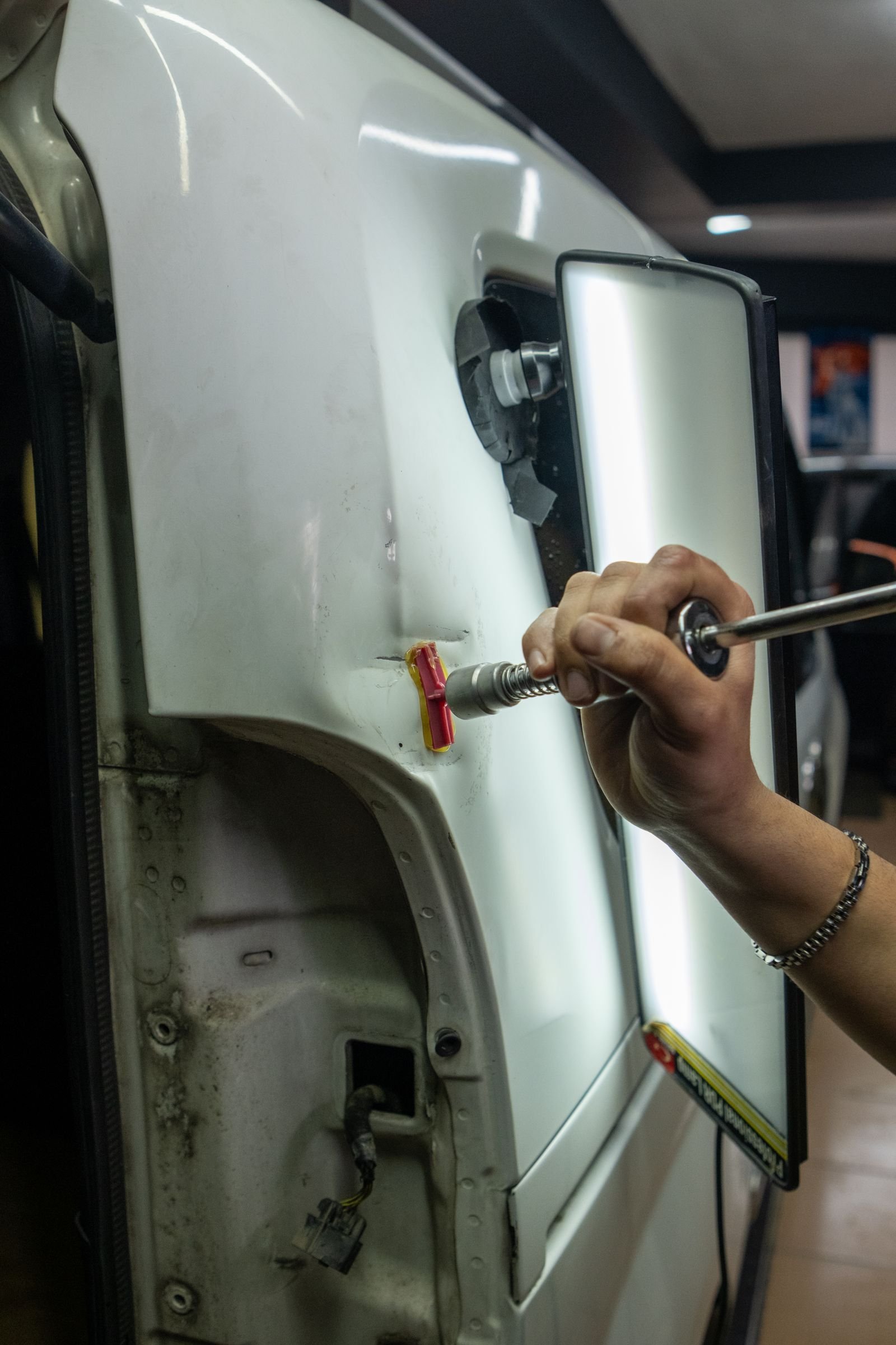 Representative photo of body and panel work being performed on a vehicle